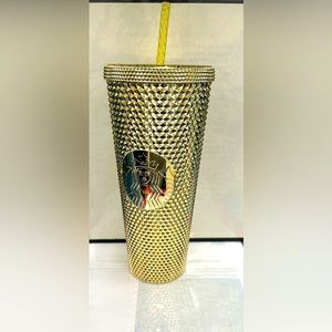 Starbucks gold cup with straw